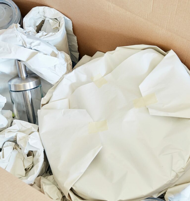 Why We Recommend Packing Belongings for Storage with Acid Free Paper
